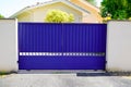 Classic blue door metal home gate at entrance of house portal garden Royalty Free Stock Photo