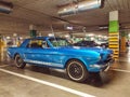 Classic blue Ford Mustang coupe veteran vintage car parked in garage Royalty Free Stock Photo