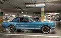 Classic blue Ford Mustang coupe veteran vintage car parked in garage Royalty Free Stock Photo