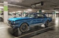 Classic blue Ford Mustang coupe veteran vintage car parked in garage Royalty Free Stock Photo