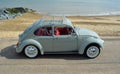 Classic Blue Grey Volkswagen Beetle Motor Car Parked on Seafront Promenade. Royalty Free Stock Photo