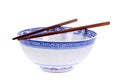 Classic blue pattern empty Chinese rice bowl with wooden chopsticks isolated on white background Royalty Free Stock Photo