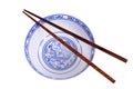 Classic blue pattern empty Chinese rice bowl with wooden chopsticks isolated on white Royalty Free Stock Photo