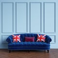 Classic blue sofa,pillows with british flag pattern standing in classic interior Royalty Free Stock Photo