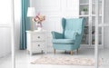 Classic blue and white theme living room - light blue armchair in white room Royalty Free Stock Photo