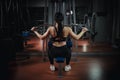 Classic bodybuilding. Muscular blonde fitness woman doing exercises in the gym. Fitness - concept of healthy lifestyle Royalty Free Stock Photo