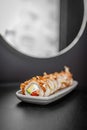 Classic Bonito sushi roll set with tuna flakes, salmon and avocado.