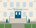 Classic brick facade of the school building or public institution with word welcome. Entrance with a porch with steps to Royalty Free Stock Photo