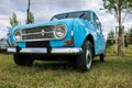 Classic bright blue Renault 4 L car on a field Royalty Free Stock Photo