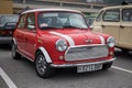 classic british compact Mini Cooper, classic red with 2 white lines Royalty Free Stock Photo