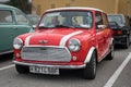 classic british compact Mini Cooper, classic red with 2 white lines Royalty Free Stock Photo
