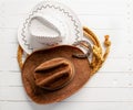 brown and white cowboy hat lasso and horseshoe wild west still life on rough white wooden table Royalty Free Stock Photo