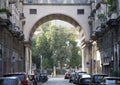 Classic building in Milan, Italy with arched bridge and columns