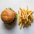 Classic burger and fries combo on white background, featuring sesame seed bun and golden fries