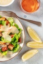 Classic Caesar salad with wine and lemons Royalty Free Stock Photo