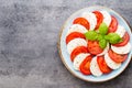 Classic caprese salad. Mozzarella tomatoes and Basilikum. Royalty Free Stock Photo