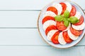 Classic caprese salad. Mozzarella tomatoes and Basilikum. Royalty Free Stock Photo