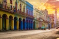 Classic car and colorful buildings  in Havana at sunset Royalty Free Stock Photo