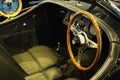 Classic car driver steering and interior dashboard.