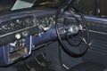 Classic car driver steering and interior dashboard.