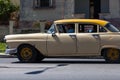 A classic car driver on the street in havana city