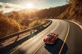 classic car driving down a sunny, scenic highway Royalty Free Stock Photo