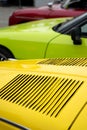 Classic car hood yellow green red Royalty Free Stock Photo