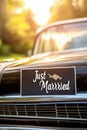 Classic car with just married sign in sunlit setting Royalty Free Stock Photo