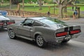 Classic car model of Shelby 1967 Mustang GT500 parked on a street - view from behind