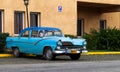 Classic car parked alone on the street Royalty Free Stock Photo