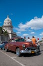 Classic car parked in front of the Havana capitol. Cuba
