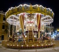 Classic carousel illuminated at night at the fair Royalty Free Stock Photo