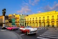 Classic cars and colorful buildings in downtown Havana Royalty Free Stock Photo