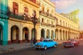 Classic cars and old colorful buildings in downtown Havana Royalty Free Stock Photo