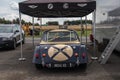 Classic cars waiting to be used for a motorsport race in the paddock area