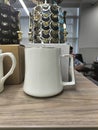 Classic Ceramic White Mug Filled with Refreshing Water - Simple and Elegant Drinkware for Daily Use