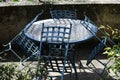 Classic chairs and iron table on a sunny terrace. Very nice blue color for these garden furniture. Summer background. Royalty Free Stock Photo