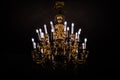 Classic chandelier isolated on black background lighten up Royalty Free Stock Photo