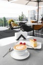 Classic cheesecake with fresh strawberry with cup of coffee on white table. Close Up view. Tasty breakfast. Piece of Royalty Free Stock Photo