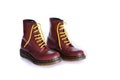 Classic cherry red oxblood lace-up boots with yellow laces Royalty Free Stock Photo