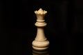 Classic Chess White Queen on black board, isolated Royalty Free Stock Photo