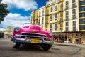 Classic Chevrolet in front of a hotel in Havana
