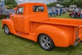 Customised Chevrolet pickup truck painted bright orange Royalty Free Stock Photo