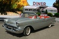 1957 Chevrolet Bel Air convertible in front of diner Royalty Free Stock Photo