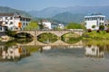 Classic Chinese architecture of bridge crossing river at Hongcun Village, Anhui China