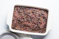 Classic chocolate cake with colored sprinkles in baking dish