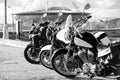 CLassic chopper, low-power bike and sport bike standing in line, black and white image