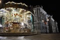 Classic Christmas Carousel with the facade of royal palace as background, Madrid, Spain Royalty Free Stock Photo