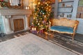 Classic Christmas New Year decorated interior room home library with fireplace. Christmas tree with gold ornament