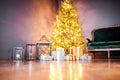 Classic christmas New Year decorated interior room New year tree. Christmas tree with gold decorations. Modern white classical sty Royalty Free Stock Photo